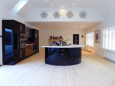 Light finished boards in an open-plan kitchen