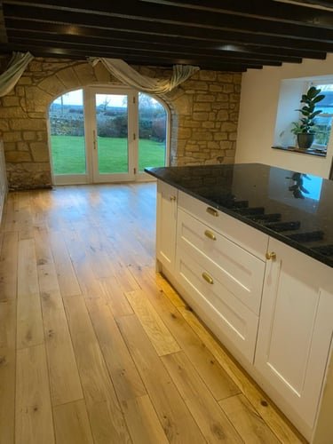 Sanded and sealed oak floor in a farmhouse kitchen