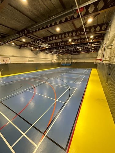 Resilient sports hall floor in blue and yellow